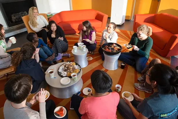 Group of students having tea and snacks